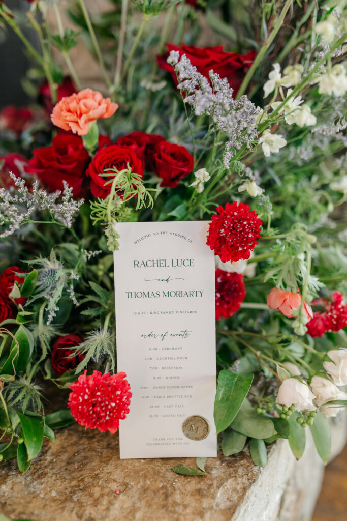 Garden-style winter wedding floral design in red, blue, and white tones in Virginia
