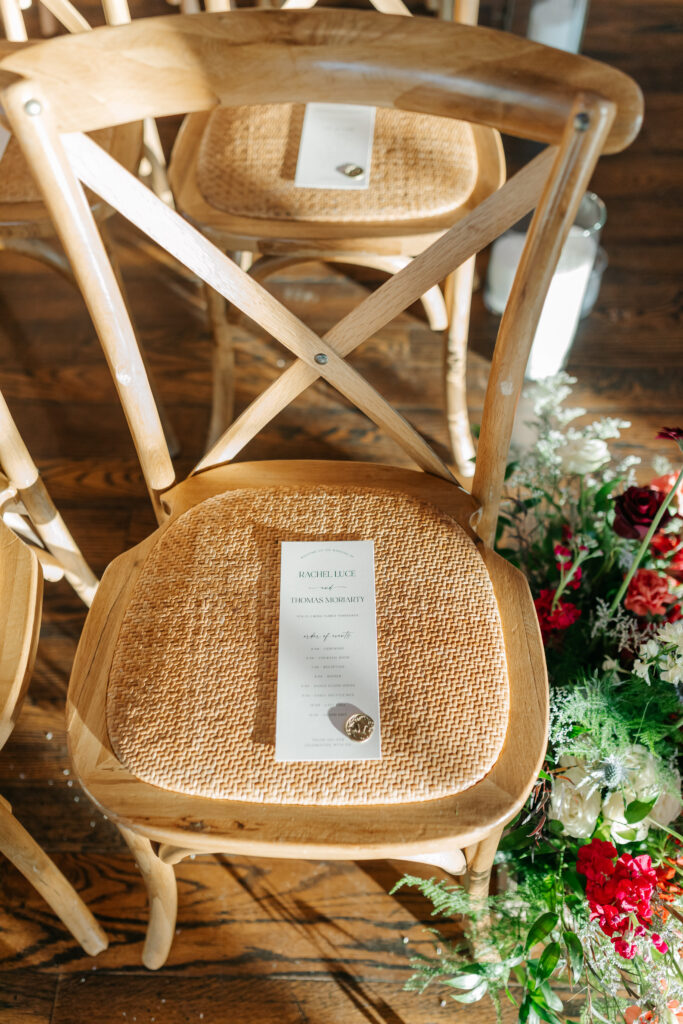 Winter wedding aisle meadow with red, blue, and white florals at King Family Vineyards