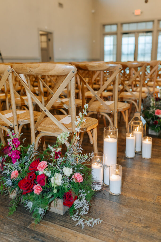 Garden-inspired ceremony aisle flowers with layered candlelight and lanterns in Crozet Virginia