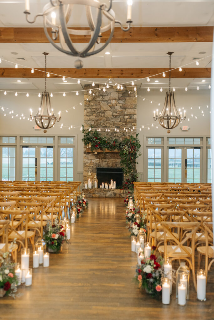 Garden-inspired wedding ceremony flowers with candlelit aisle at King Family Vineyards wedding