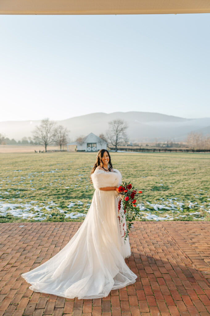Colorful bridal bouquet with red, blue, and white flowers for Virginia winter wedding
