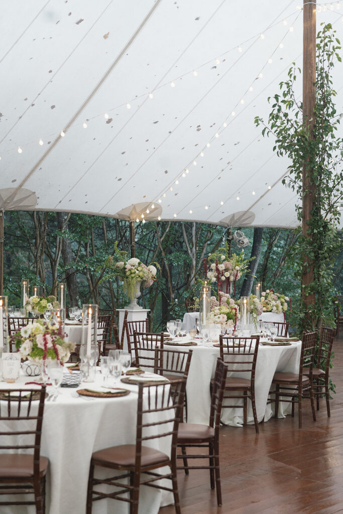 Live trees and modern floral installations designed for luxury tented wedding in Charlottesville Virginia