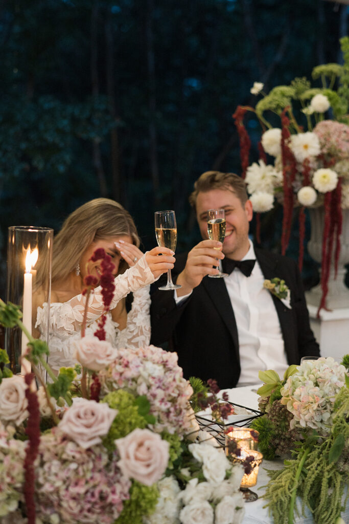 Contemporary floral centerpiece design with layered hydrangeas, burgundy dahlias, and modern textures at The Clifton wedding