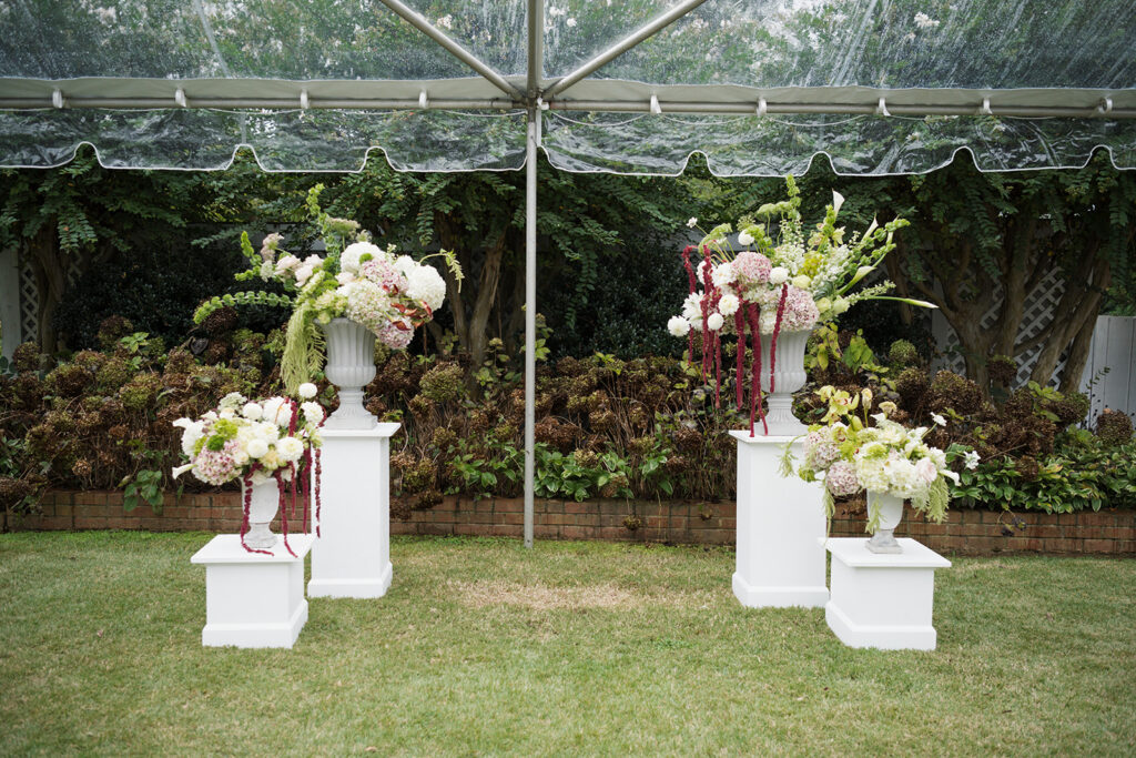 Editorial wedding floral design with hydrangeas, dahlias, and cascading amaranthus at The Clifton