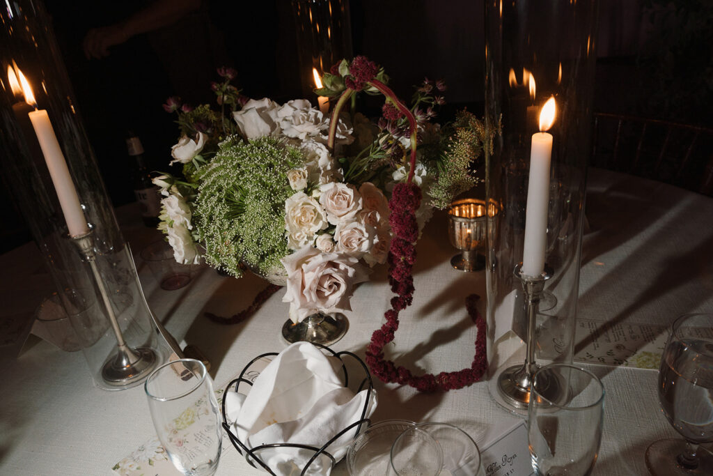Structural floral centerpiece with dahlias, calla lilies, and cascading amaranthus at Charlottesville luxury wedding